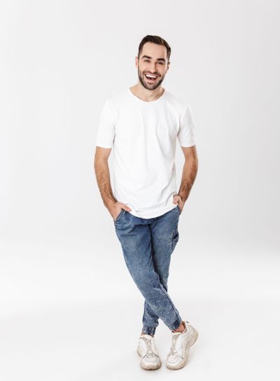 Full length of a handsome cheerful man