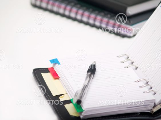Office stationary - Pen and diary on white