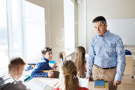 group of students and teacher at school classroom
