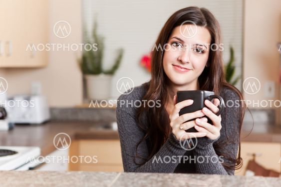 Woman holding coffee cup