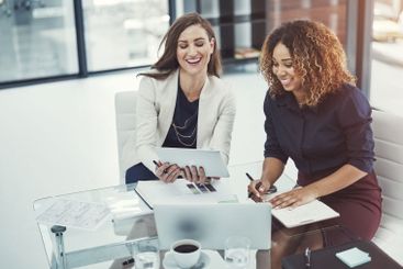 Documents, meeting and technology with business women in...