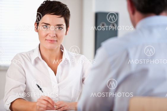 Manager interviewing a male applicant