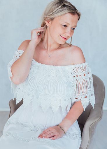 Beautiful blonde woman in summer white wedding dress