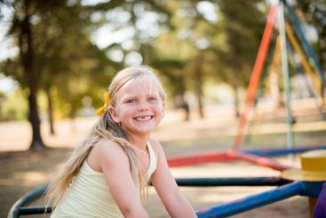 Fun, playground and youth with girl in park for growth,...