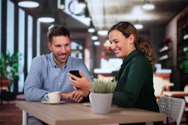 Coworkers Using Technology Lifestyle. Man And Woman...