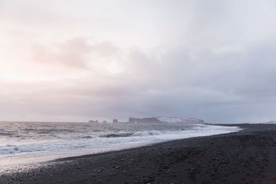 majestic seacoast with wavy sea and cliffs, vik...