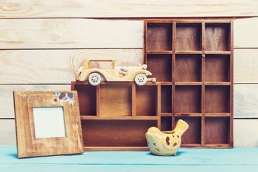 Cozy pastel wooden home decor objects on blue background