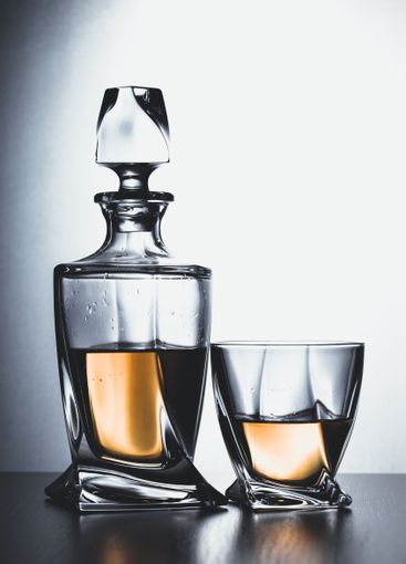 Strong alcoholic drink in glass close up