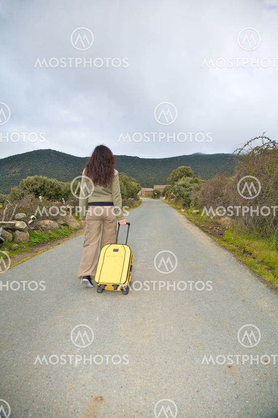 walking with suitcase