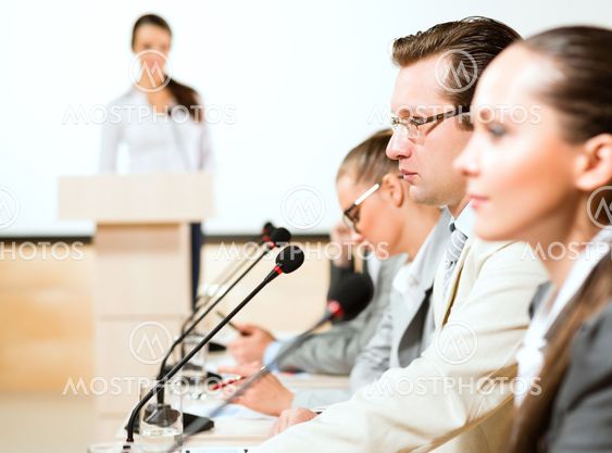 businessmen communicate at the conference