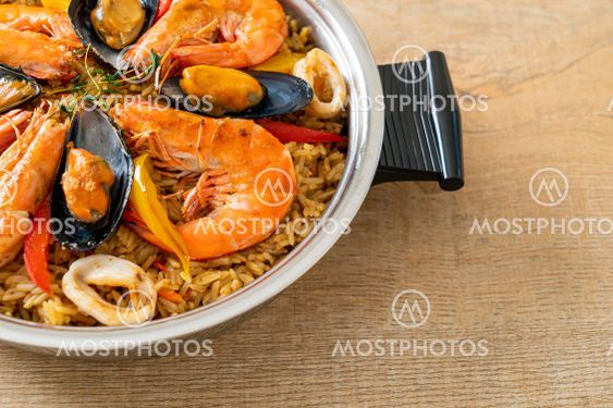 Seafood Paella with prawns, clams, mussels on saffron rice