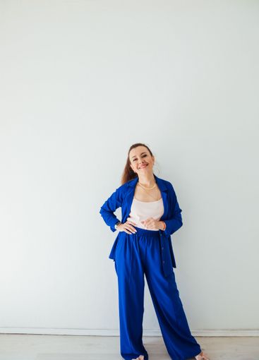 Brunette woman 40 years old in blue summer suit