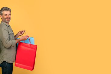 Portrait of middle aged caucasian spouses showing credit...