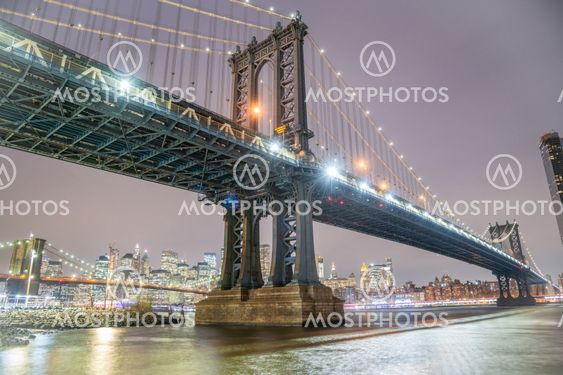 Amazing night view of Manhattan and Brooklyn Bridge at...