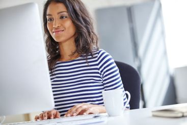 Woman, typing and professional with computer in office,...