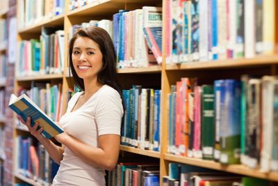 Beautiful student holding a book