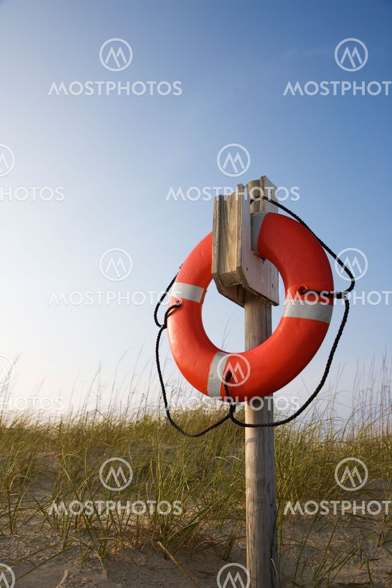 Life preserver on beach.