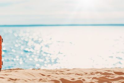 Panoramic view of the seacoast with suitcase on the...