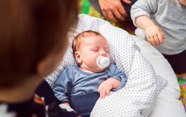 Baby boy (2-5 months) sleeping with pacifier