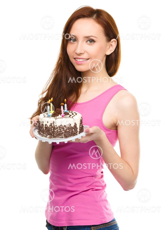 Young woman with anniversary cake