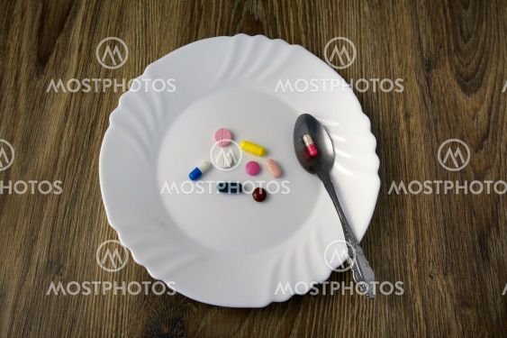 A bunch of pills on a plate