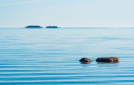 Serene morning at Lake Vanern in Sweden with calm waters...