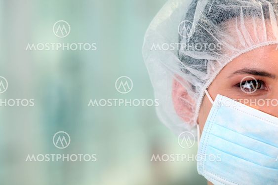 Surgeon wearing a mask