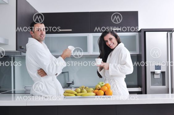 young couple have fun in modern kitchen