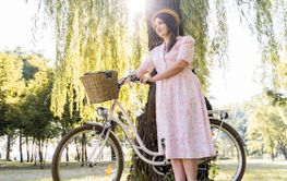 elegant young woman posing with bike 5
