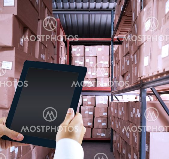 Composite image of man using tablet pc