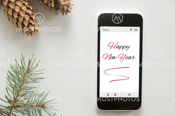 Top view of a mobile phone, Happy new year on the screen