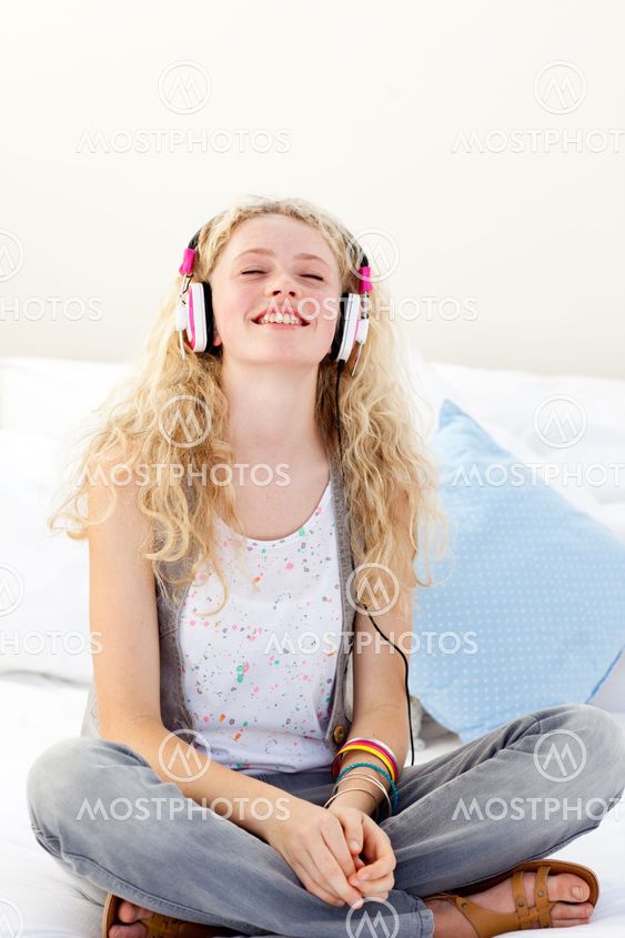 Beautiful teenager listening to the music
