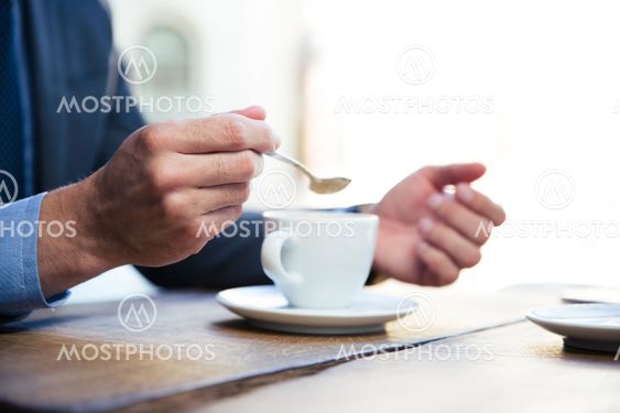 Businessman`s hands with coffee