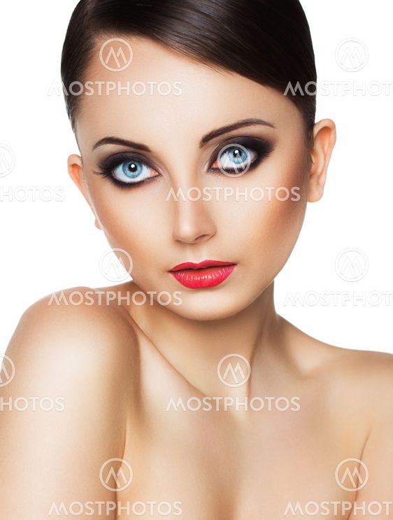 Portrait of a beautiful young woman with a glamorous retro makeup