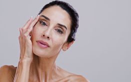 Beauty, skincare and portrait of mature woman in studio...
