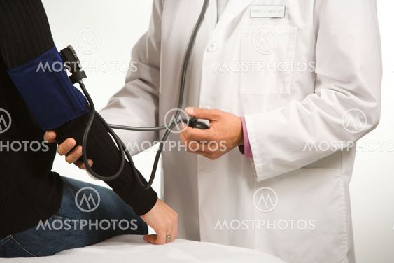 Doctor testing blood pressure.