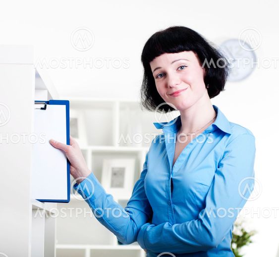 woman puts a tablet with documents in a Shelfs