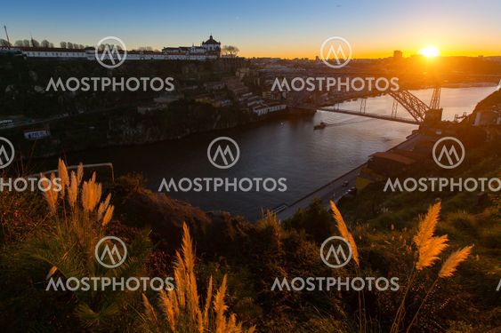 Douro river and Dom Luis I bridge at sunset, Porto,...