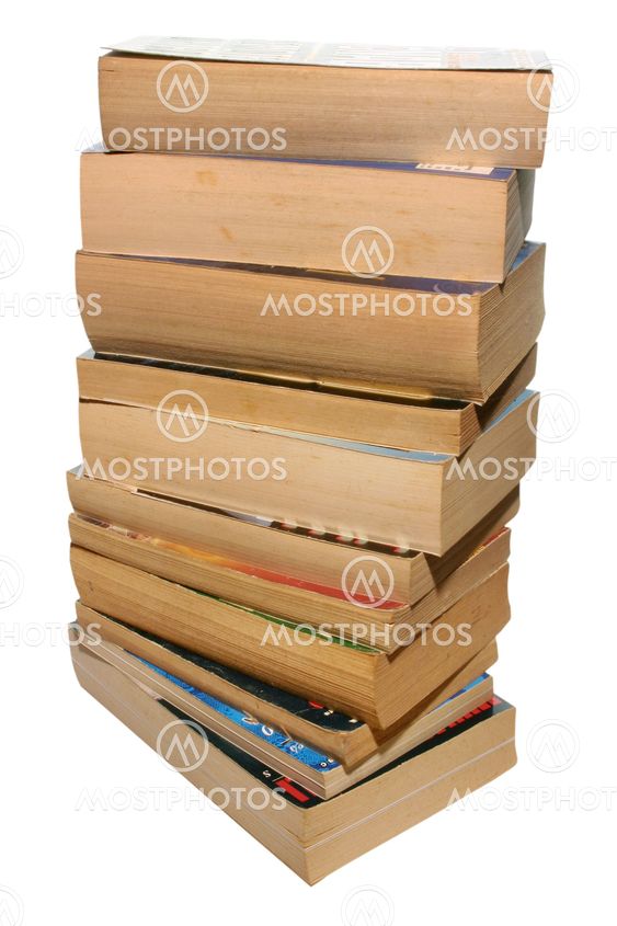 A stack of old paperback books, isolated on a white...