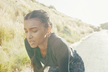 Tired, woman and running for fitness outdoor for...