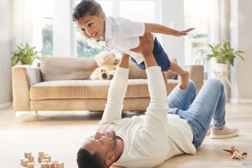 Father, boy and floor with airplane game for childhood...