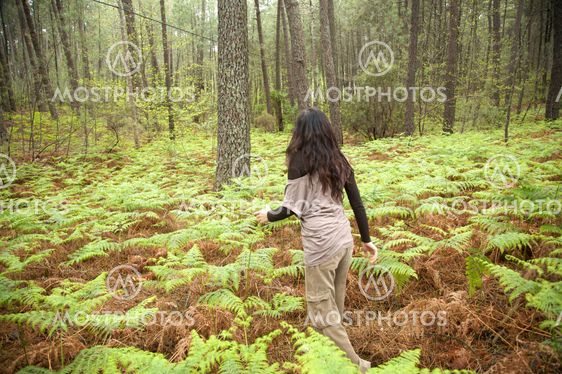 woman between fern