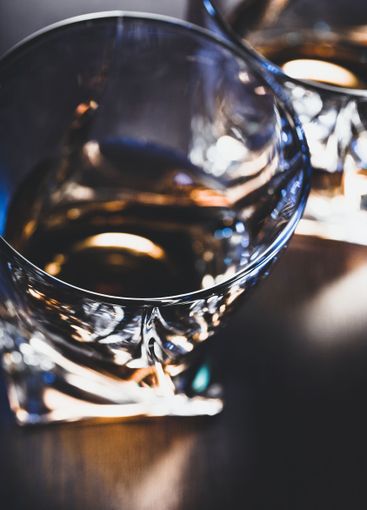 Strong alcoholic drink in glass close up