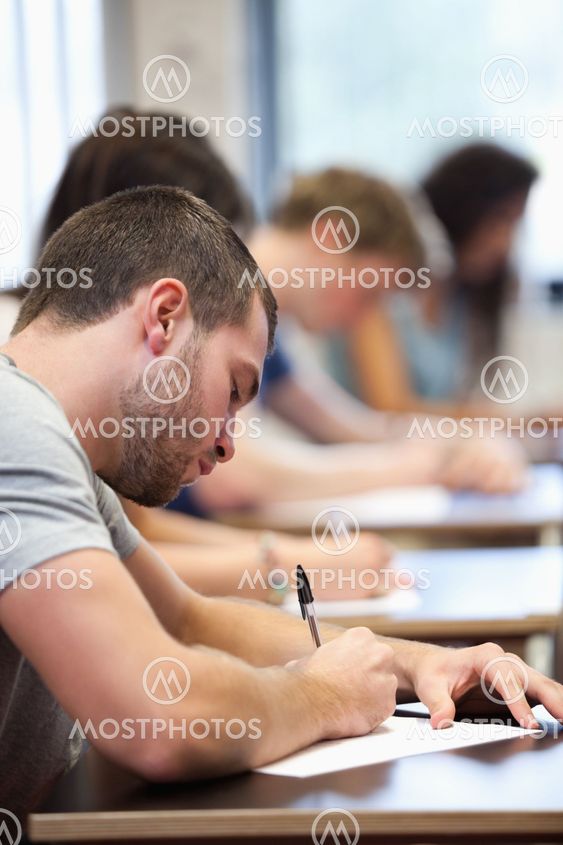 Portrait of a young man writing