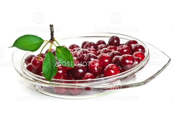 cherries on a glass dish