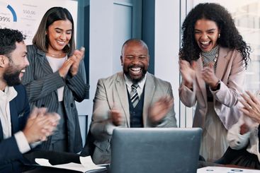 Business people, laptop and meeting with celebration for...