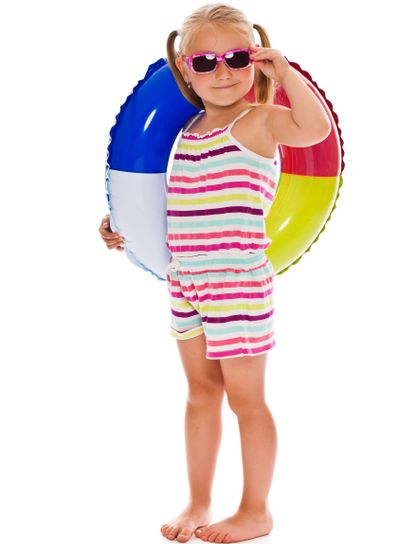 little girl with sunglasses and inflatable ring