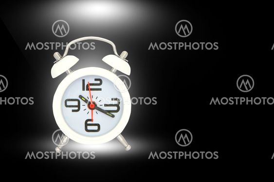 alarm clock isolated over black