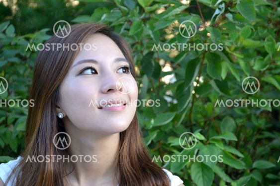 Beautiful young asian woman thinking