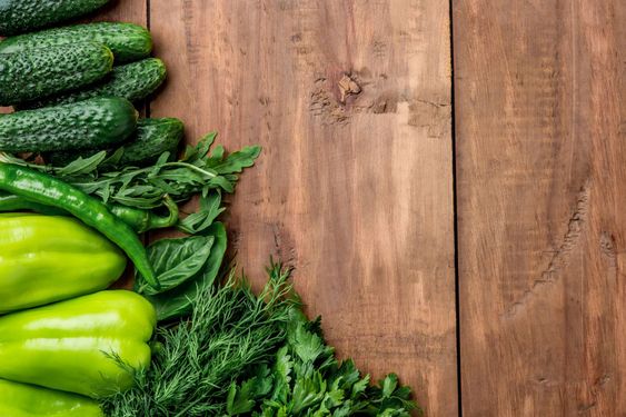 The green vegetables on wooden table